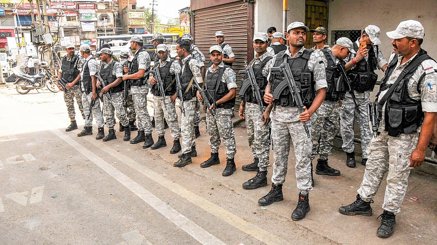 Security personnel stand alert, a day after clashes during protest against now-suspended BJP leaders' remarks on Prophet Muhammed, in Ranchi. Credit: PTI Photo
