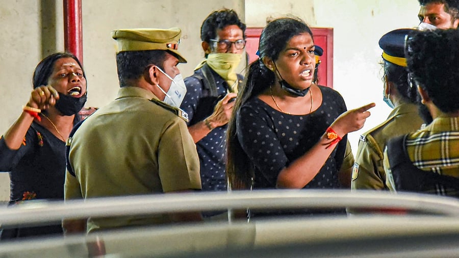Trans women interact with police after they were allegedly taken into custody for wearing black clothes near the venue of a programme of Kerala Chief Minister Pinarayi Vijayan, in Kochi, Saturday, June 11, 2022. Credit: PTI Photo