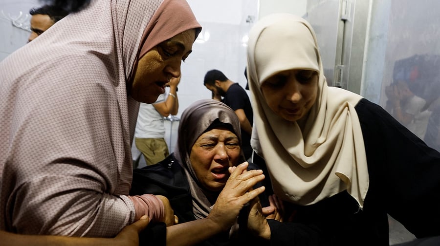 People mourn the dead at a hospital following an Israeli raid in Jenin, in the Israeli-occupied West Bank June 17, 2022. Credit: Reuters Photo