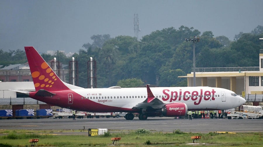 The Delhi-bound SpiceJet airplane following its emergency landing after it caught fire mid-air, at Jai Prakash Narayan Airport, in Patna. Credit: PTI Photo