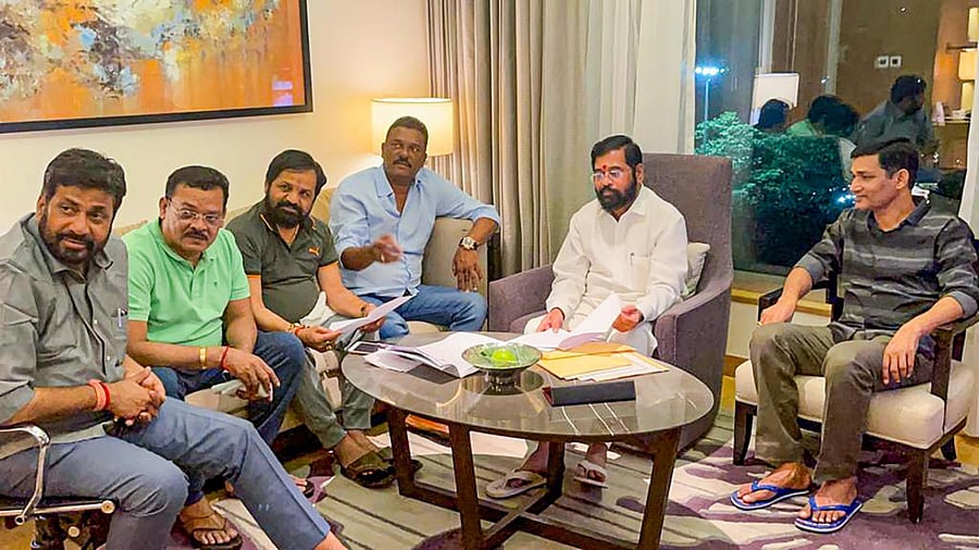 Rebel Shiv Sena leader Eknath Shinde with other MLAs at a hotel in Guwahati. Credit: PTI Photo