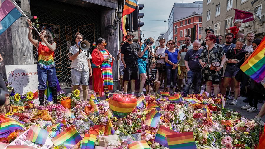 People pay tribute to victims of the shooting, in central Oslo, Norway. Credit: Reuters Photo