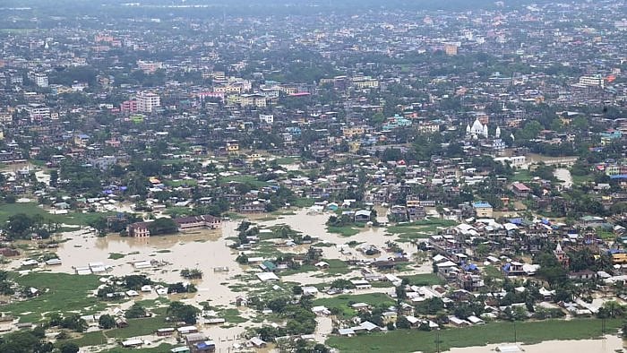 Aerial view of the flood-affected area as seen by Assam Chief Minister Himanta Biswa Sarma during his survey, in Silchar. Credit: PTI Photo