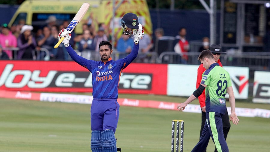 Deepak Hooda celebrates his century during the second Twenty20 International cricket match between Ireland and India at Malahide cricket club, in Dublin. Credit: AFP Photo