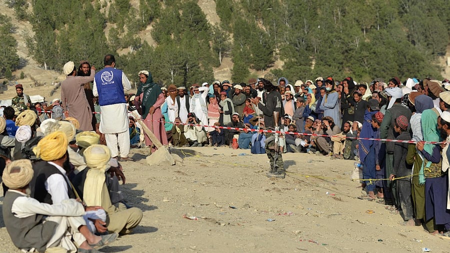 Taliban fighters stand guard. Credit: AFP Photo