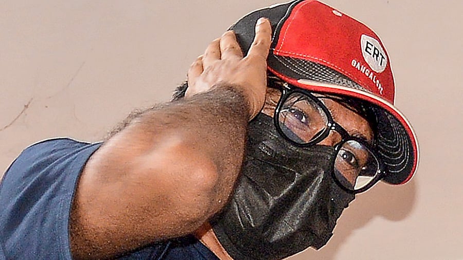 Mohammed Zubair, the co-founder of fact-checking website Alt News, being brought by the Delhi Police. Credit: PTI Photo