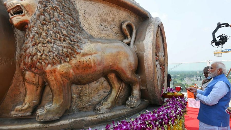 Prime Minister Narendra Modi at the unveiling ceremony of the National Emblem at the roof of the New Parliament Building. Credit: IANS Photo