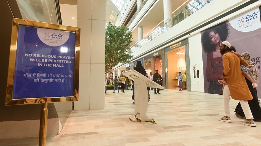 Notices regarding the ban of religious prayers put up inside the atrium of LuLu Mall. Credit: PTI Photo