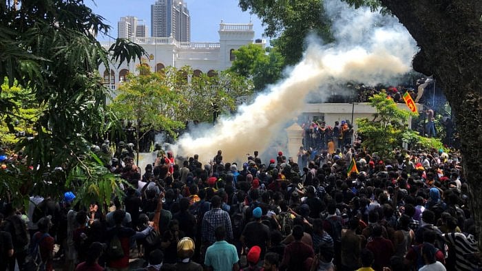 Demonstrators gather outside the office of Sri Lanka's PM Wickremesinghe, in Colombo. Credit: Reuters Photo
