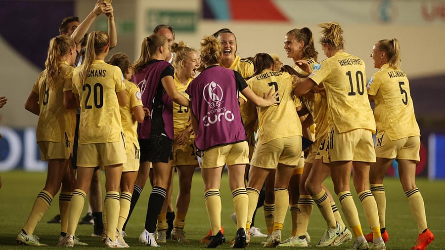 Belgium players celebrate after progressing to the quarter finals. Credit: Reuters Photo
