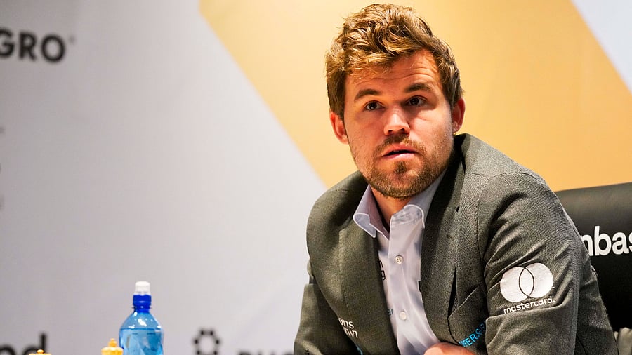 Magnus Carlsen of Norway competes during the FIDE World Championship at Dubai Expo 2020 in Dubai. Credit: AP/PTI File Photo