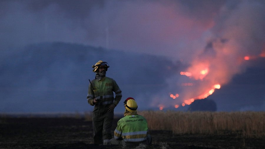 Firefighters work at the site of a wildfire outside Tabara, Zamora in Spain. Credit: Reuters Photo