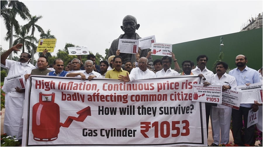 Opposition parties MPs protest against the Central government over the issues of inflation and GST hike in essential commodities, at Parliament in New Delhi. Credit: IANS Photo