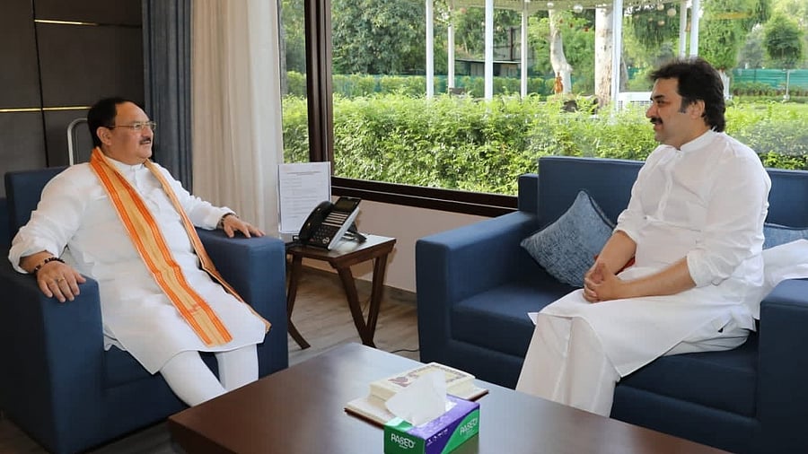 Adampur MLA Kuldeep Bishnoi with J P Nadda. Credit: IANS Photo