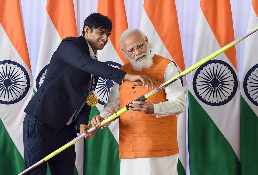 Narendra Modi and Neeraj Chopra. Credit: PTI Photo