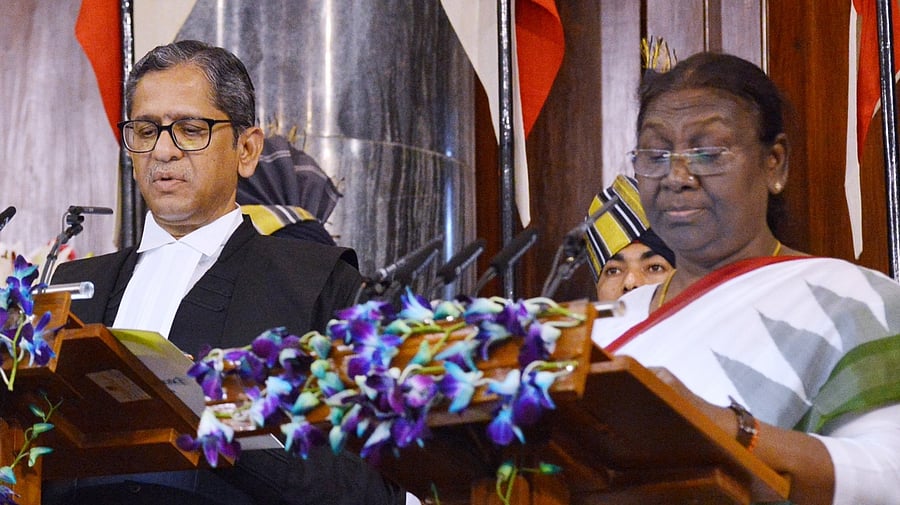 President-elect Droupadi Murmu takes oath as the 15th President of India administered by Chief Justice of India NV Ramana at the Central Hall of the Parliament in New Delhi on Monday, July 25, 2022. Credit: IANS Photo