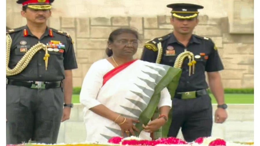 President-elect Droupadi Murmu pays homage to Mahatma Gandhi at Rajghat ahead of her swearing-in ceremony, in New Delhi, July 15, 2022. Credit: PTI Photo
