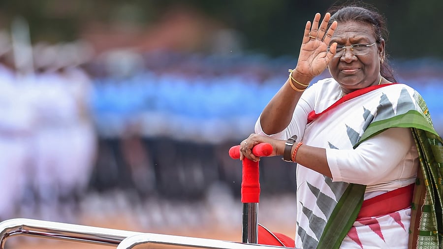 President Droupadi Murmu during a guard of honour by the Tri-services personnel at the forecourt of the Rashtrapati Bhavan. Credit: PTI Photo