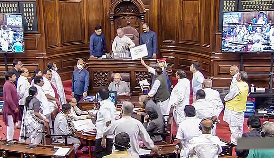 Opposition members protest in the Rajya Sabha during ongoing Monsoon Session of Parliament. Credit: PTI Photo