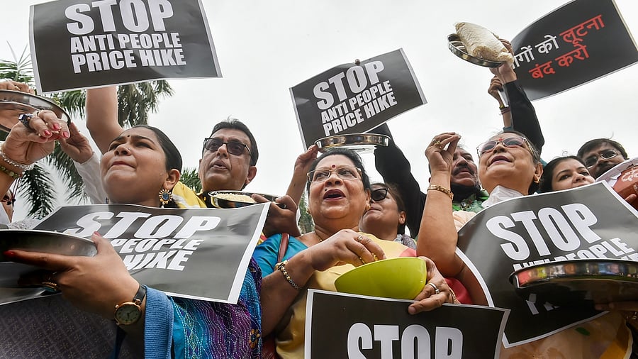 TMC MPs stage a protest over price rise during the ongoing Monsoon Session of Parliament. Credit: PTI Photo