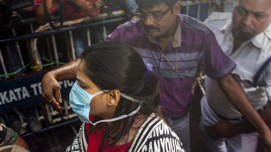 Arpita Mukherjee, close aide of West Bengal Minister Partha Chatterjee, being produced at a court a day after she was arrested by Enforcement Directorate (ED) in connection with its investigation into the teacher recruitment scam. Credit: PTI Photo