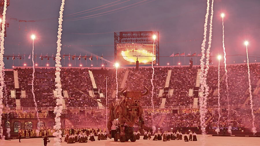 Artists perform near a giant mechanical raging bull during the opening ceremony of Commonwealth Games 2022. Credit: PTI Photo