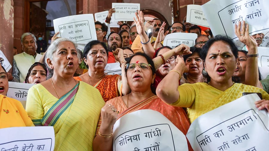 Union Finance Minister Nirmala Sitharaman with other BJP MPs during a protest against Congress leader Adhir Ranjan Chowdhury's remarks on President Droupadi Murmu, at Parliament House, in New Delhi, Thursday, July 28, 2022. Credit: PTI Photo