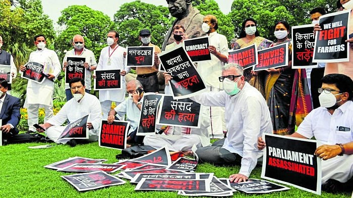 Derek O'Brien of TMC and other opposition parties members stage a protest over suspension of Rajya Sabha members and other issues, during ongoing Monsoon Session of Parliament, in New Delhi. Credit: PTI Photo