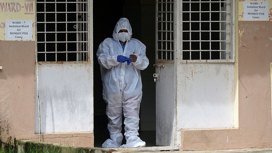 A nurse wearing protective gear stands at the entrance of an isolation ward for monkeypox patients at a government hospital. Credit: AFP Photo