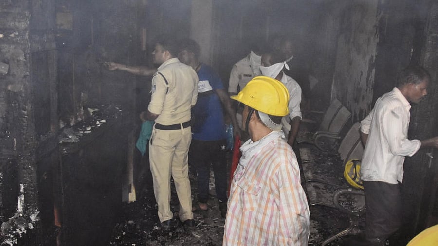 Police and fire personnel inspect after a major fire broke out at the Life Multispeciality Hospital at Damoh Naka, in Jabalpur, Monday, Aug 1, 2022. Credit: PTI Photo
