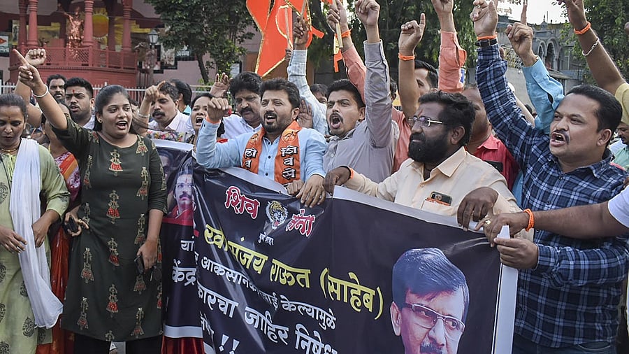 Shiv Sena activists stage a protest after party leader Sanjay Raut was detained by ED in an alleged land scam case. Credit: PTI Photo