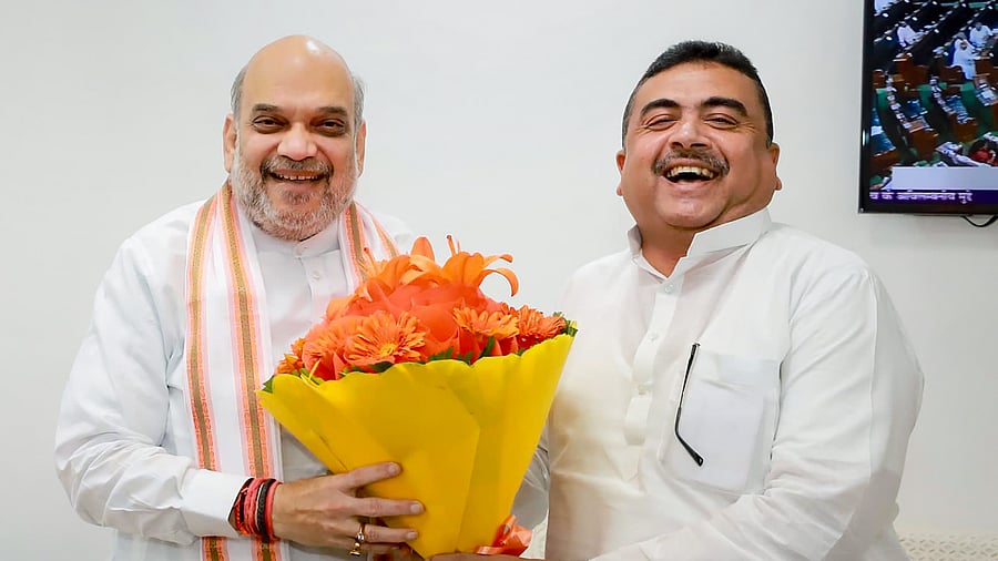 West Bengal BJP MLA Suvendu Adhikari greets Union Home Minister Amit Shah, at a meeting in New Delhi, Tuesday, Aug 2, 2022. Credit: PTI Photo