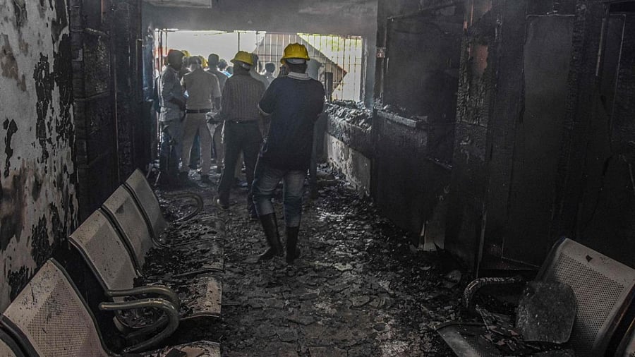 First responders inspect a burnt-out a hospital after a fire broke out in Jabalpur. Credit: AFP Photo