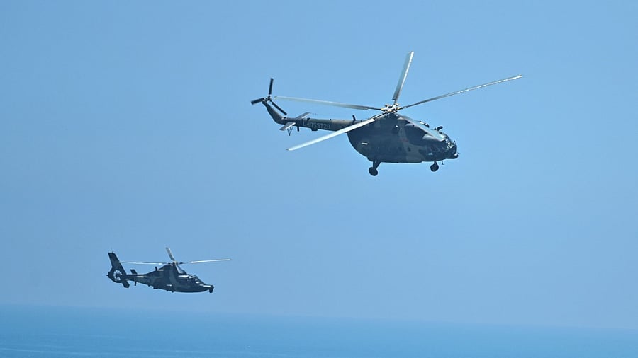 Chinese military helicopters fly past Pingtan island, one of mainland China's closest point from Taiwan. Credit: AFP Photo