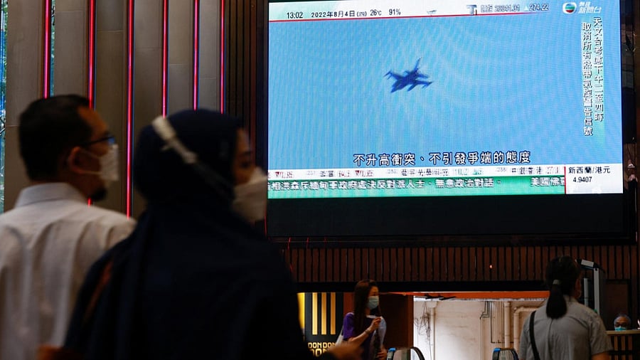 A TV screen shows that China's People's Liberation Army has begun military exercises including live firing on the waters and in the airspace surrounding the island of Taiwan, in Hong Kong. Credit: Reuters Photo