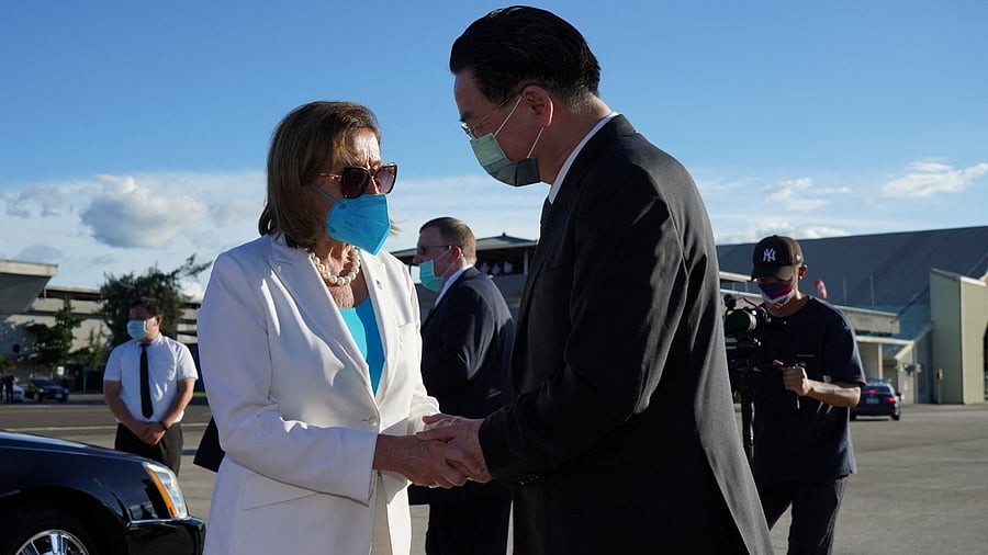 US House of Representatives Speaker Nancy Pelosi talks with Taiwan Foreign Minister Joseph Wu before boarding a plane. Credit: Reuters Photo 