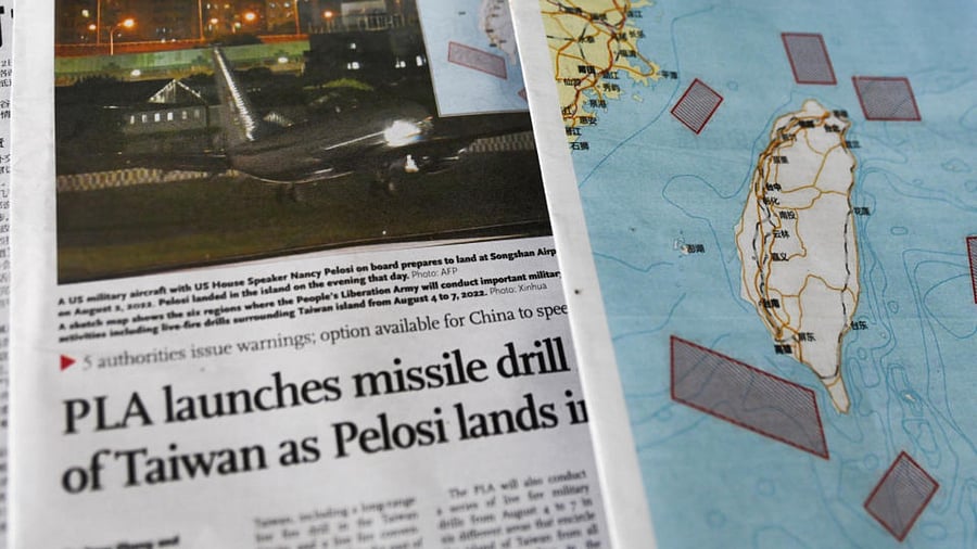 A map showing locations where Chinese People's Liberation Army (PLA) will conduct military exercises and training activities including live-fire drills is seen on newspaper reports of US House of Representatives Speaker Nancy Pelosi's visit to Taiwan, at a newsstand in Beijing, China August 3, 2022. Credit: Reuters Photo