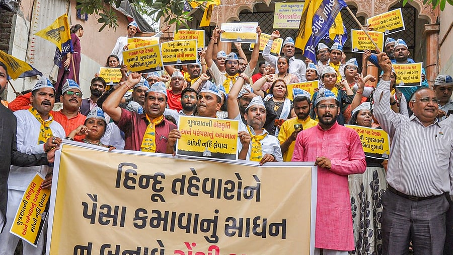 The Congress and AAP have held protests in Vadodara, Surat and Valsad on Tuesday and Wednesday seeking withdrawal of GST. Credit: PTI Photo