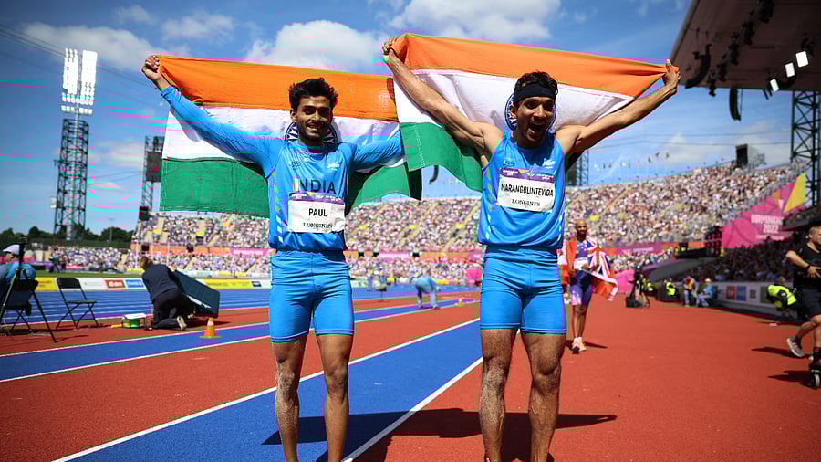India's Eldhose Paul and Abdulla Aboobacker Narangolintevida celebrate after winning gold and silver respectively, Birmingham, August 7, 2022. Credit: Reuters Photo