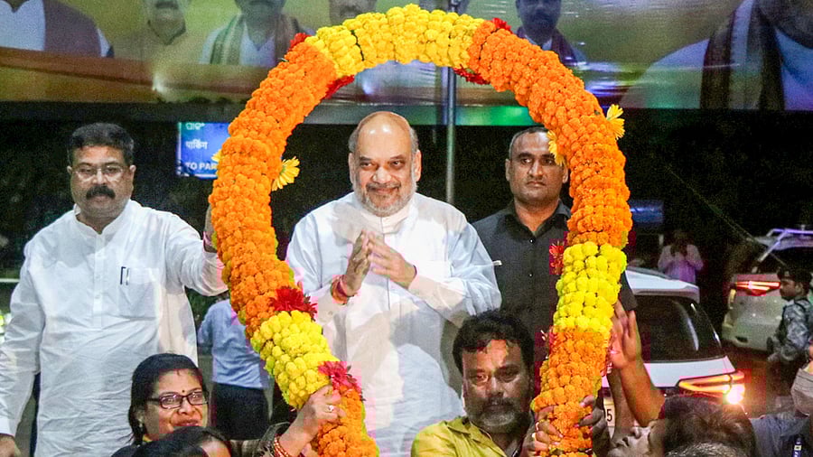 Union Home Minister Amit Shah being welcomed upon his arrival at the Biju Patnaik International Airport, in Bhubaneswar, Sunday night, August 7, 2022. Credit: PTI Photo
