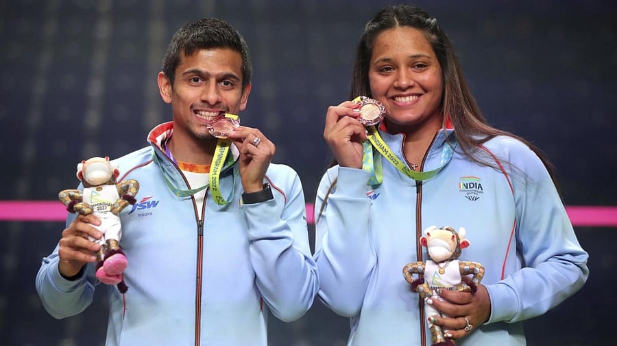 Saurav Ghosal and Dipika Pallikal Kartik pose with their bronze medals after finishing third at the University of Birmingham Hockey and Squash Centre on day ten of the 2022 Commonwealth Games in Birmingham. Credit: AP/PTI Photo