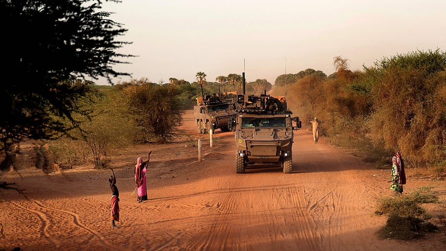In this file photo taken on December 04, 2021 French soldiers patrol the streets of the village of Guintou near Gao. Credit: AFP File Photo