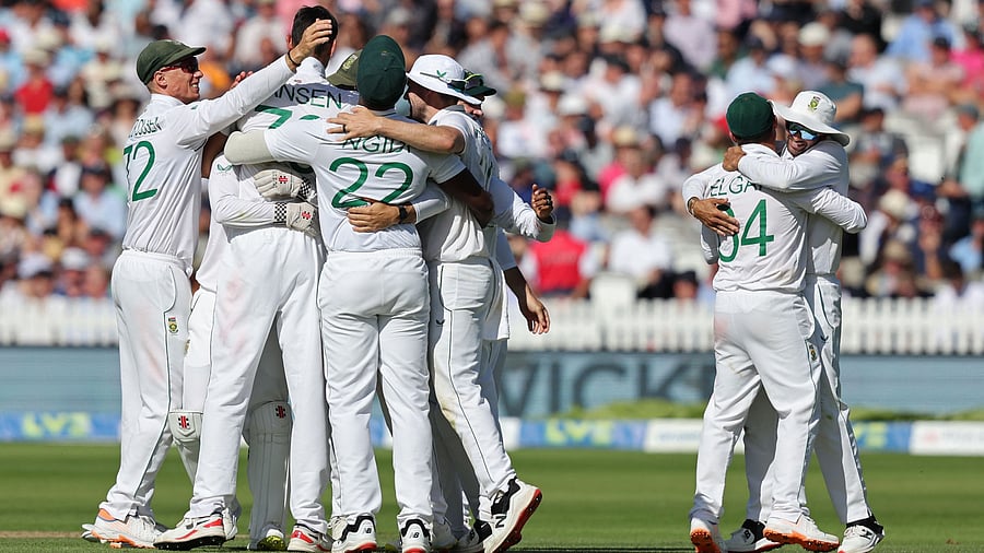 South Africa's players celebrate after England's James Anderson is bowled by South Africa's Marco Jansen. Credit: AFP Photo