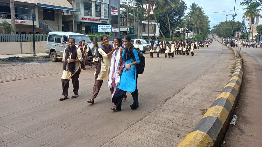 College students on way back home after leopard was spotted at Club Road in Belagavi on Monday. Credit: Special Arrangement