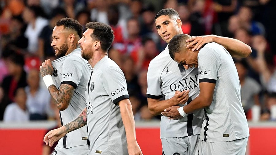 Paris Saint-Germain's French forward Kylian Mbappe (R) celebrates with teammates after scoring his team's sixth goal during the French L1 football match between Lille OSC and Paris-Saint Germain (PSG). Credit: AFP Photo