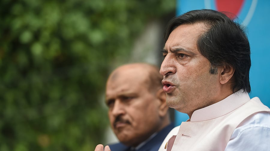 Lone, who was accompanied by party leader and former law secretary of Jammu and Kashmir Mohammad Ashraf, said under the Constitution of India, enrolling outsiders as voters in Jammu and Kashmir was not possible. Credit: PTI Photo