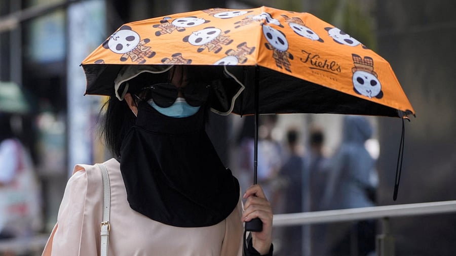 <div class="paragraphs"><p>A person covering themselves to avoid the extreme sunrays during a heat wave. Image for representation only.</p></div>