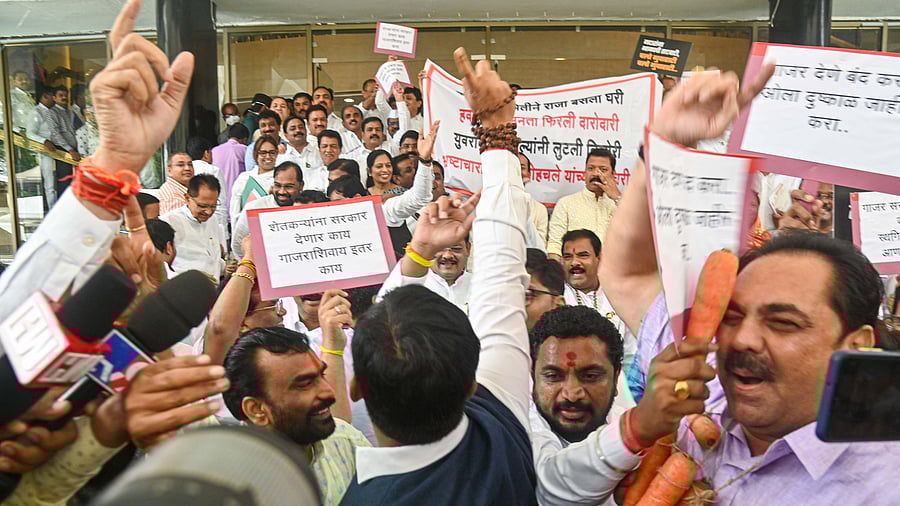 Opposition and rebel Shiv Sena MLAs raise slogans against each other. Credit: PTI Photo