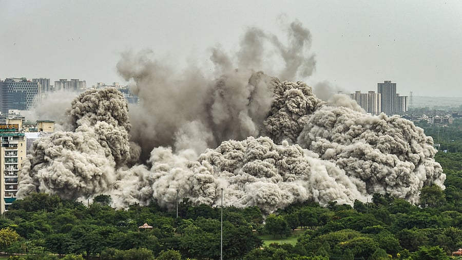 'It felt like structures of corruption were coming down,' remarked Purshotam Mishra (42)as the Supertech twin towers disappeared into plumes of smoke and dust. Credit: PTI photo