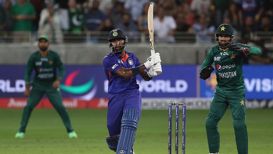 India's Hardik Pandya hits a boundary to win the Asia Cup Twenty20 international cricket Group A match between India and Pakistan at the Dubai International Cricket Stadium in Dubai on August 28, 2022. Credit: AFP Photo